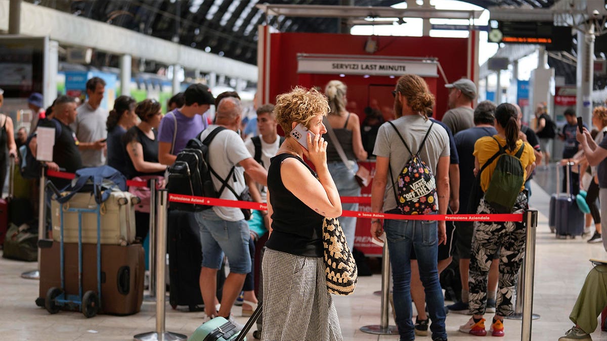 Passengers at a train ticket office