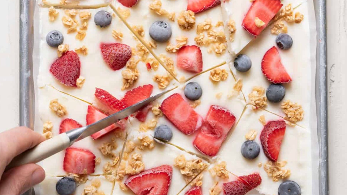 yogurt bark being cut