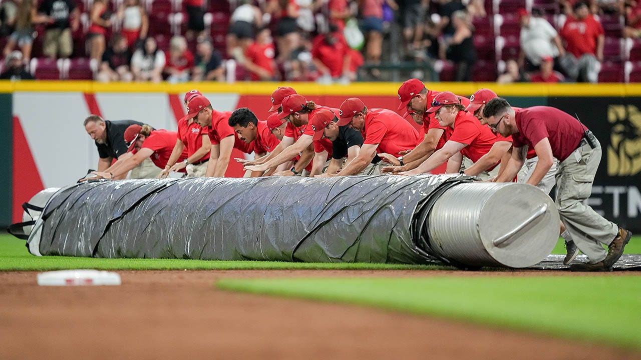 Reds grounds crew member gets gobbled up by 'tarp monster' during