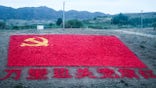 The Chinese Communist Party flag, built with 10,200 stones