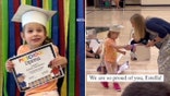 Estella Henderson walks at graduation