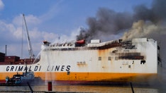 NJ cargo ship blaze that killed 2 firemen expected to burn for several more days