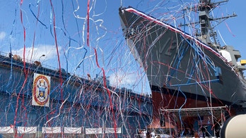 Medal of Honor recipient christens future US Navy destroyer that will bear his name