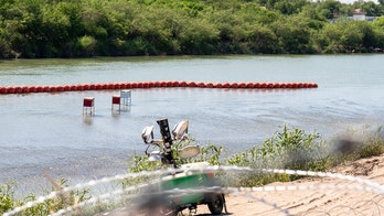 Justice Department files injunction against Texas over floating border barrier in Rio Grande