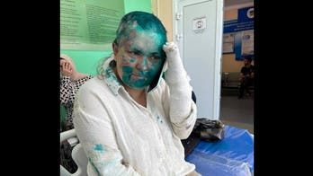 Russian journalist beaten in Chechnya returns to Moscow, in 'difficult' condition