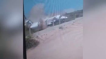 WATCH: Plane skids off runway upon arrival, smashes to pieces on protective barrier