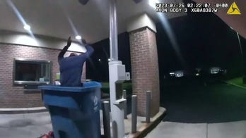 See it: Bank robber drops from ceiling straight into trash bin, caught by police