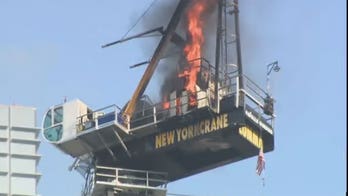 New York City construction crane catches on fire before collapse