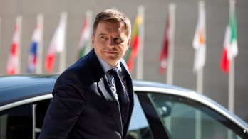 Slovak central bank head refuses to resign over bribery charges