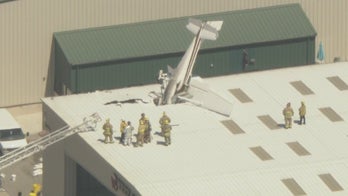Small plane crashes into Southern California airport roof, buried nose first