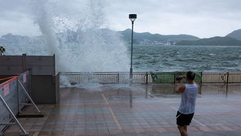 Typhoon Talim sweeps south of Hong Kong, prompting schools, stock market to close