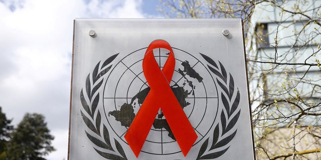 A logo is pictured outside a building of the United Nations AIDS agency 