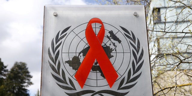 A logo is pictured outside a building of the United Nations AIDS agency 