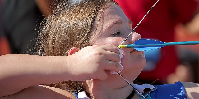 Vivan Hoop competes in archery