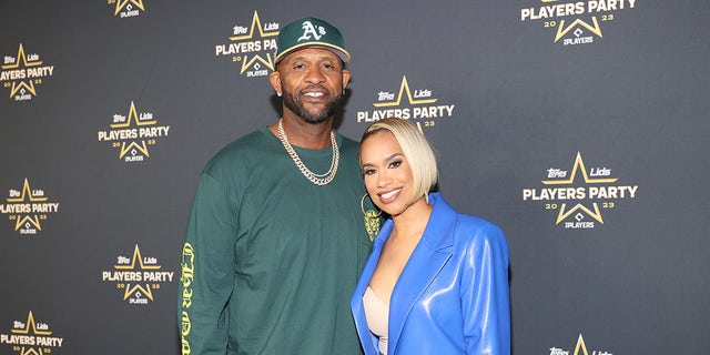 CC Sabathia poses on the red carpet with his wife, Amber