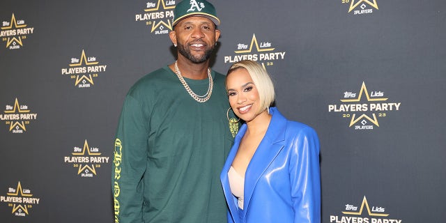 CC Sabathia poses on the red carpet with his wife, Amber