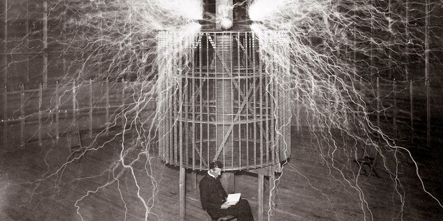 tesla in a lab surrounded by electricity