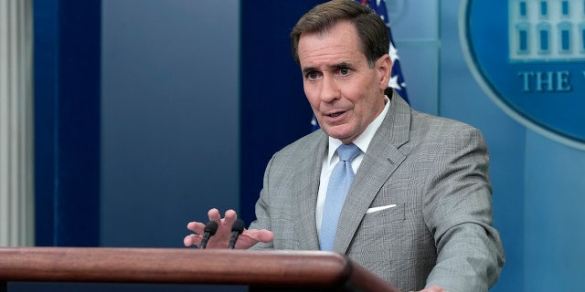 John Kirby stands at White House podium