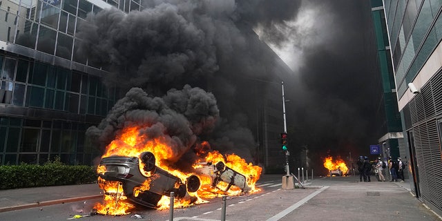 A car set fire in the streets outside Paris