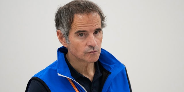 Rafael Mariano Grossi, Director General of the International Atomic Energy Agency, seen in a blue vest taking a reporter's question