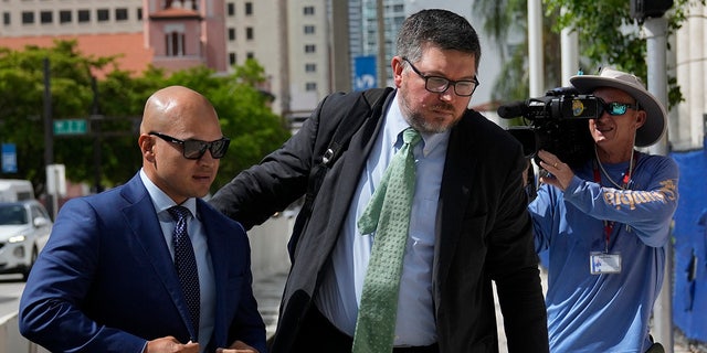 Nauta and attorney outside Miami court