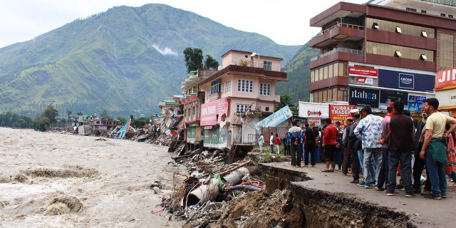 People stand by a road