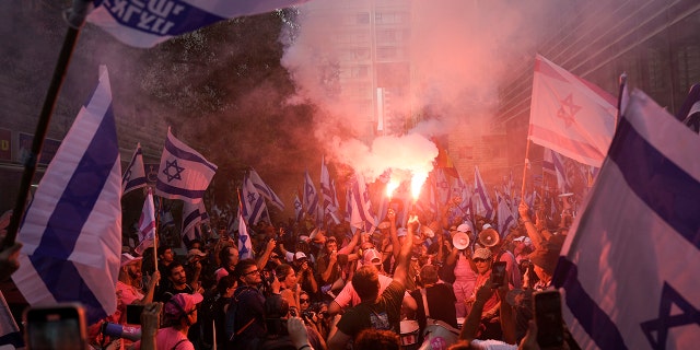 People holding a flare