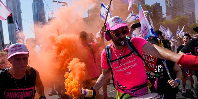 Smoke, people protesting in Israel