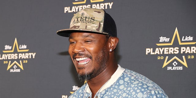 Adam Jones laughs on red carpet