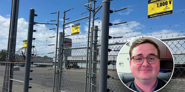 Mans face in front of fence