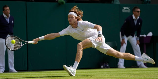 Andrey Rublev returns a shot