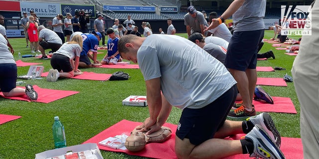 Anthony Rizzo practicing CPR