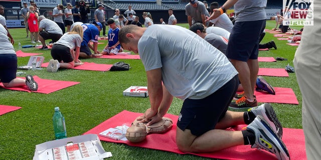 Anthony Rizzo practicing CPR