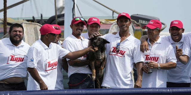 Bella with tuna boat crew