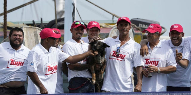 Bella with tuna boat crew