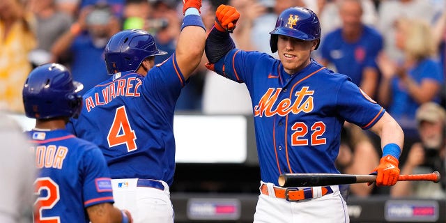 Brett Baty celebrates with Fransisco Álvarez