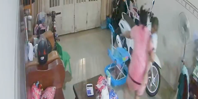 Mother saves child before ceiling collapse