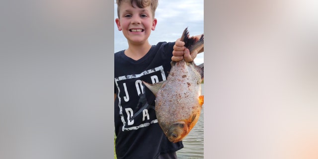 Charlie holding the Pacu fish