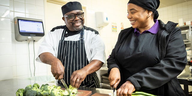 two chefs chopping veggies