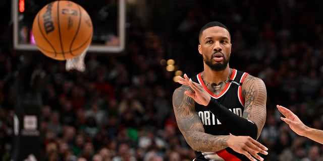 Damian Lillard passes the ball