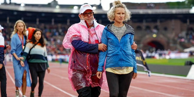 Protester escorted off the track