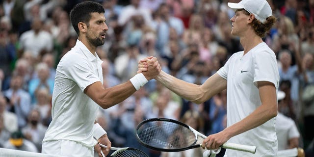 Novak Djokovic shakes hands with Jannik Sinner