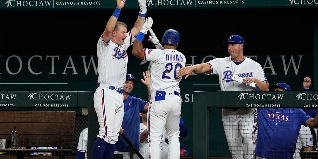 Ezequiel Duran and Josh Jung celebrate