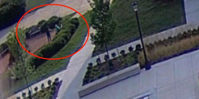 Surveillance footage shows Macedo standing over Emerson on a park bench