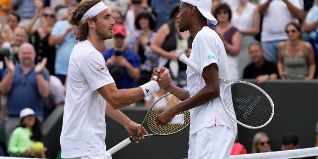 Christopher Eubanks and Stefanos Tsitsipas shake hands