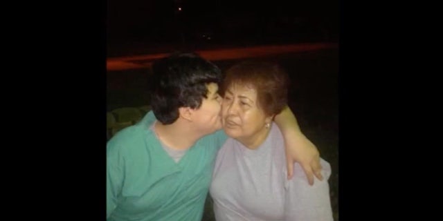 Texas man Rudy Farias kissing woman on cheek