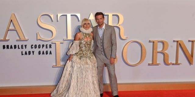 Lady Gaga and Bradley Cooper smile together on the red carpet for "A Star Is Born"