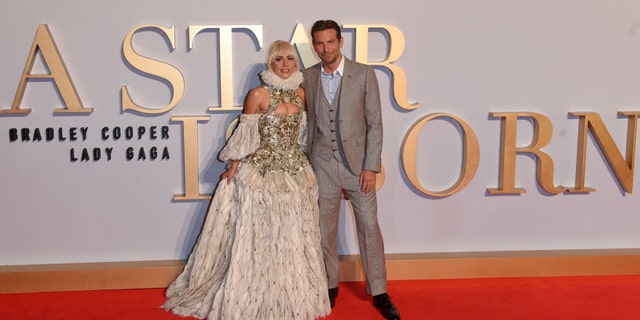 Lady Gaga and Bradley Cooper smile together on the red carpet for "A Star Is Born"