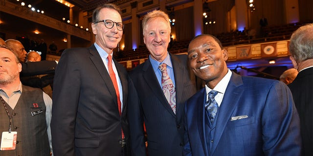 Kiki Vandeweghe, Larry Bird, and Isiah Thomas pose for a photo