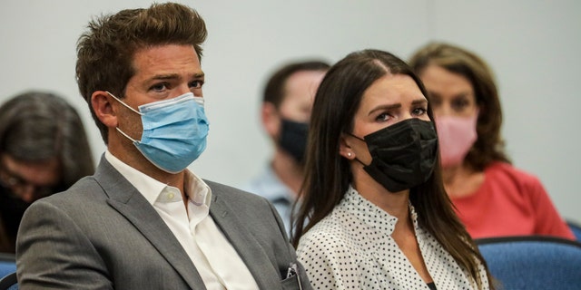 Dr. Grant Robichaux and Cerissa Riley wear face masks in court